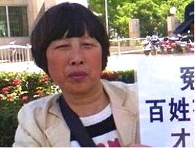 Petitioner Zhang Xiaoyu (张小玉), who has recently been detained, has suffered severe damage to her eyes from a police beating. (Image: CRLW)